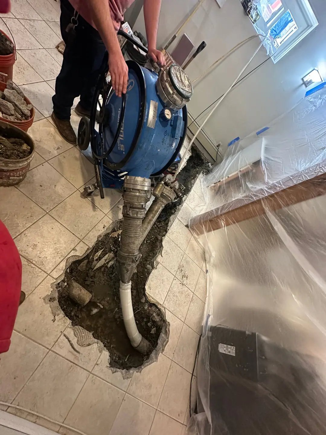 Our inversion drum connected through an opening in a tiled floor on our Back Bay job