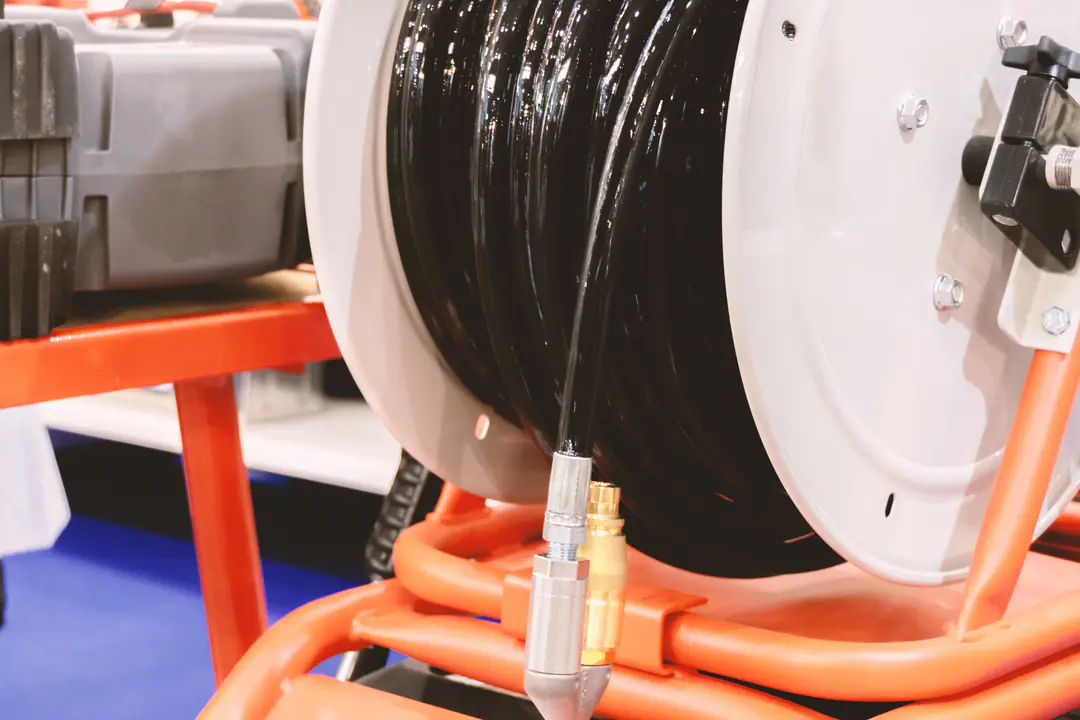High-pressure drain-cleaning hose on a reel