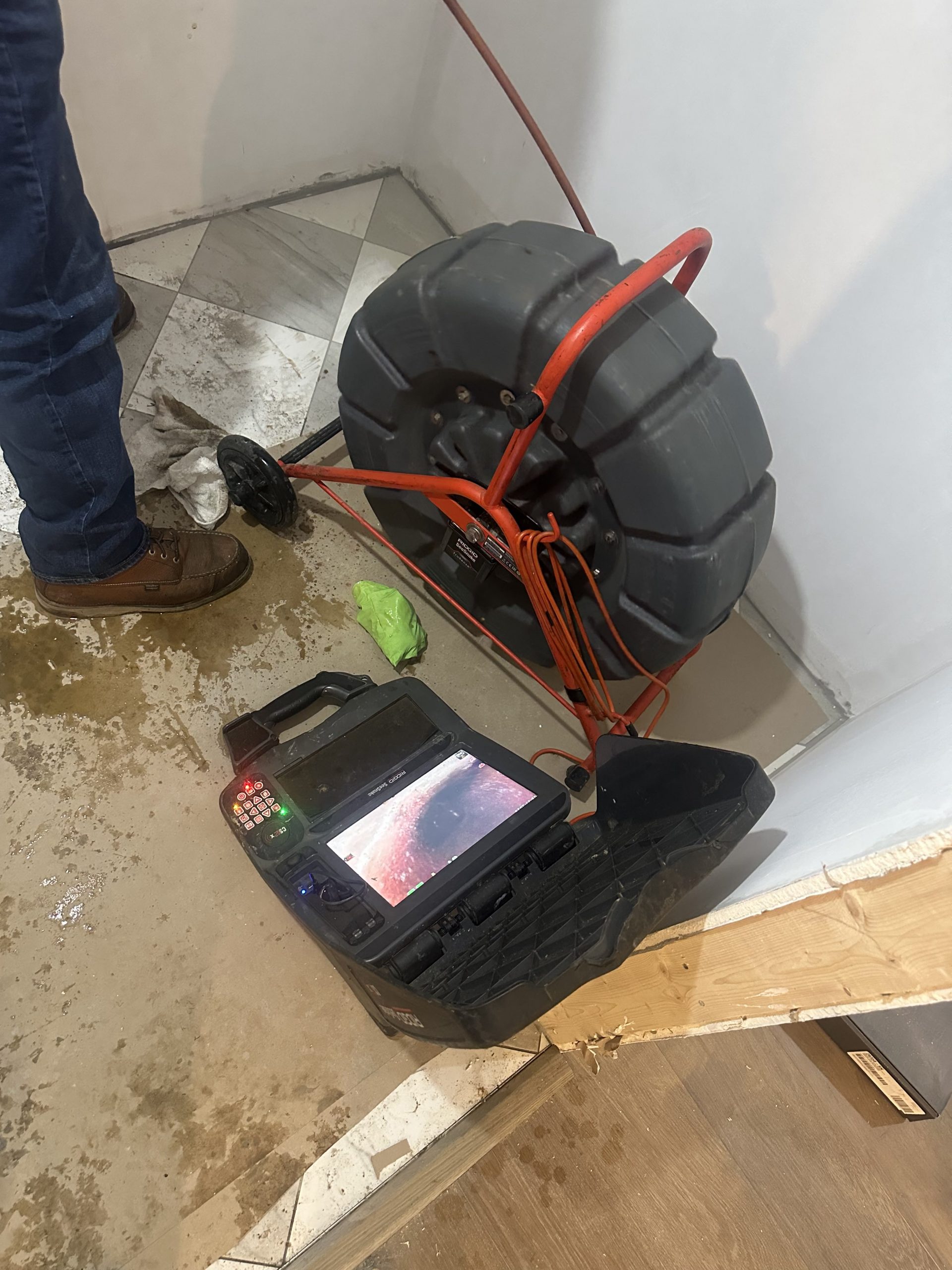 Trenchless pipelining equipment staged for UV cure liner installation in Boston home